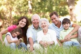 Multigenerational family sitting together outdoors